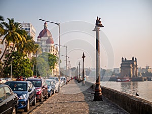 Cars parked near the promenade of Gateway of India and LuxuryÃÂ hotel Taj